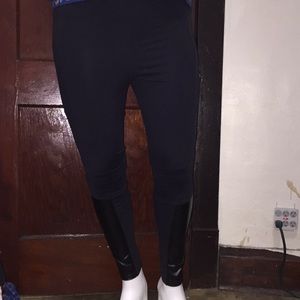 Black leggings with faux leather patches.